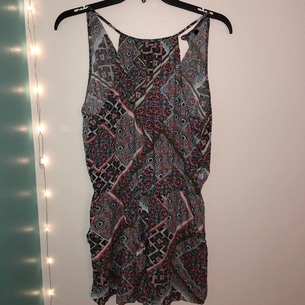 Fun floral romper with a tie in the front.